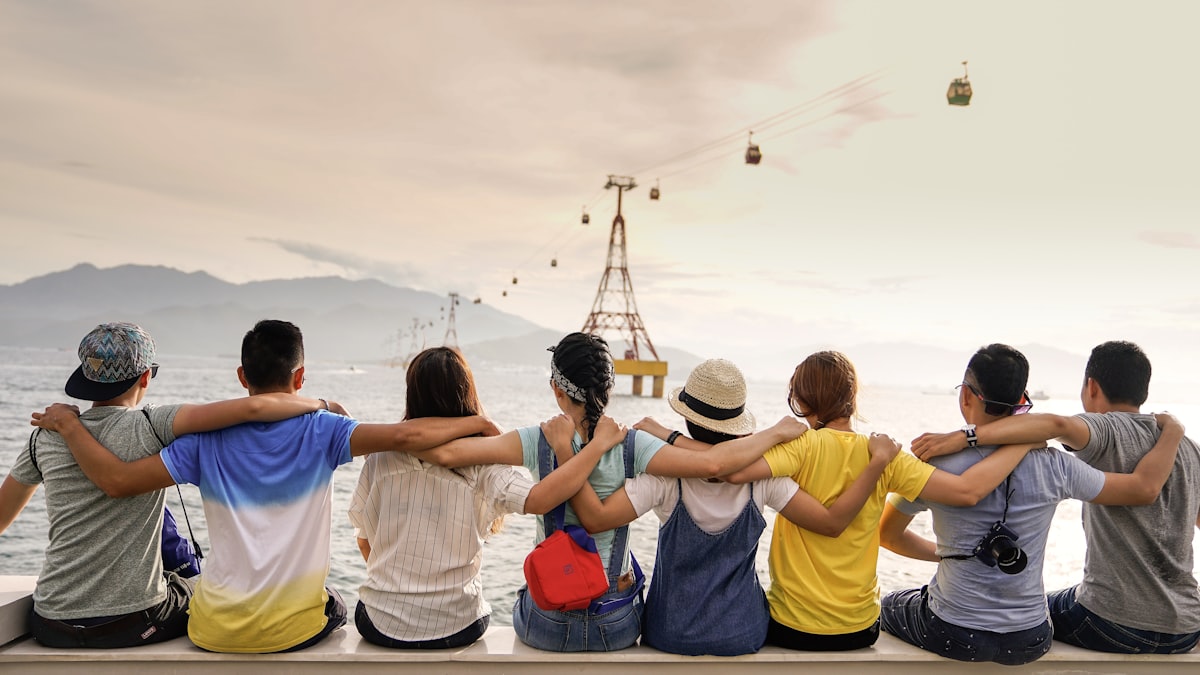 A group of people embracing one another in community